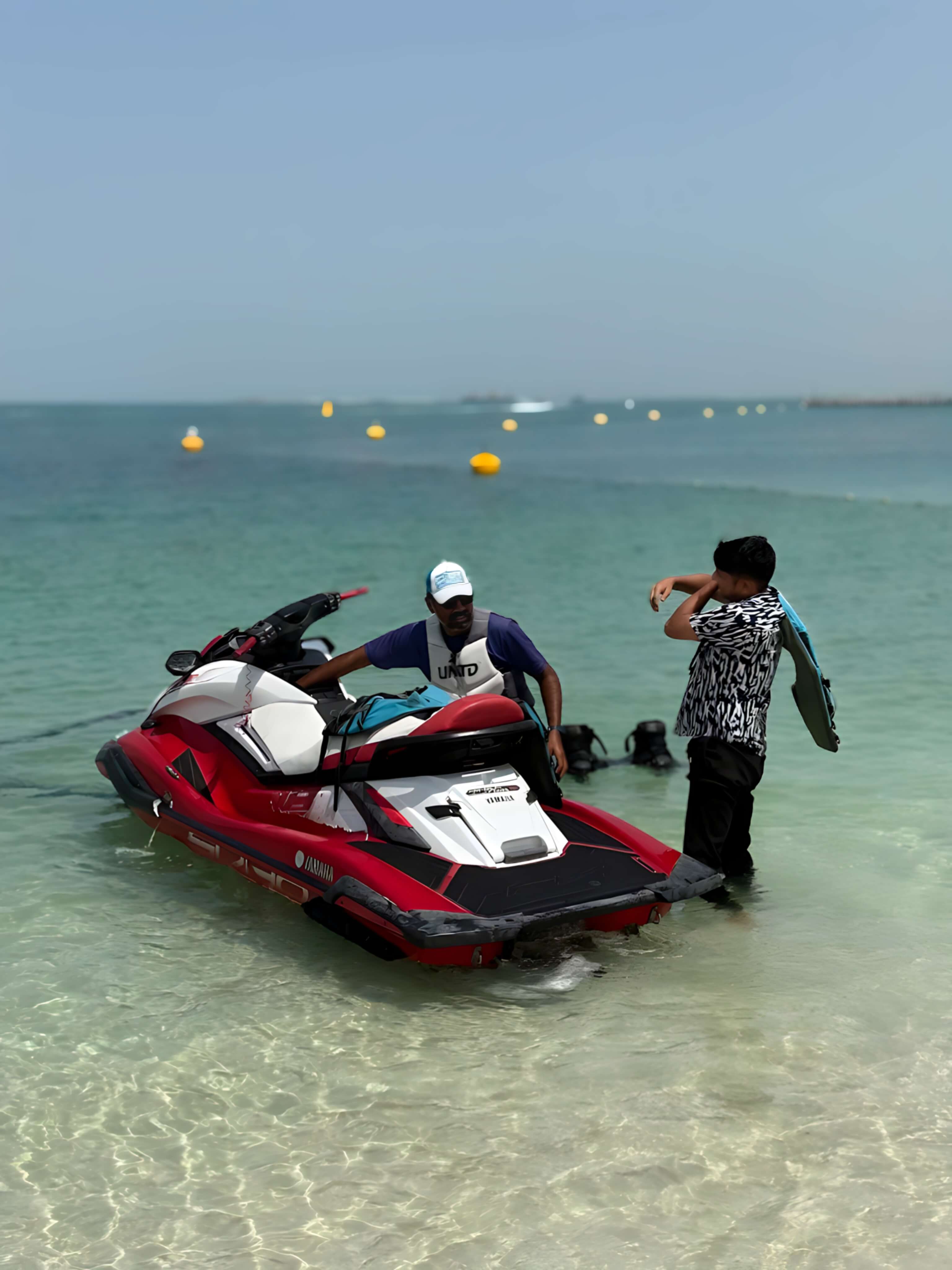 Jet skis lined up on a Dubai beach in summer