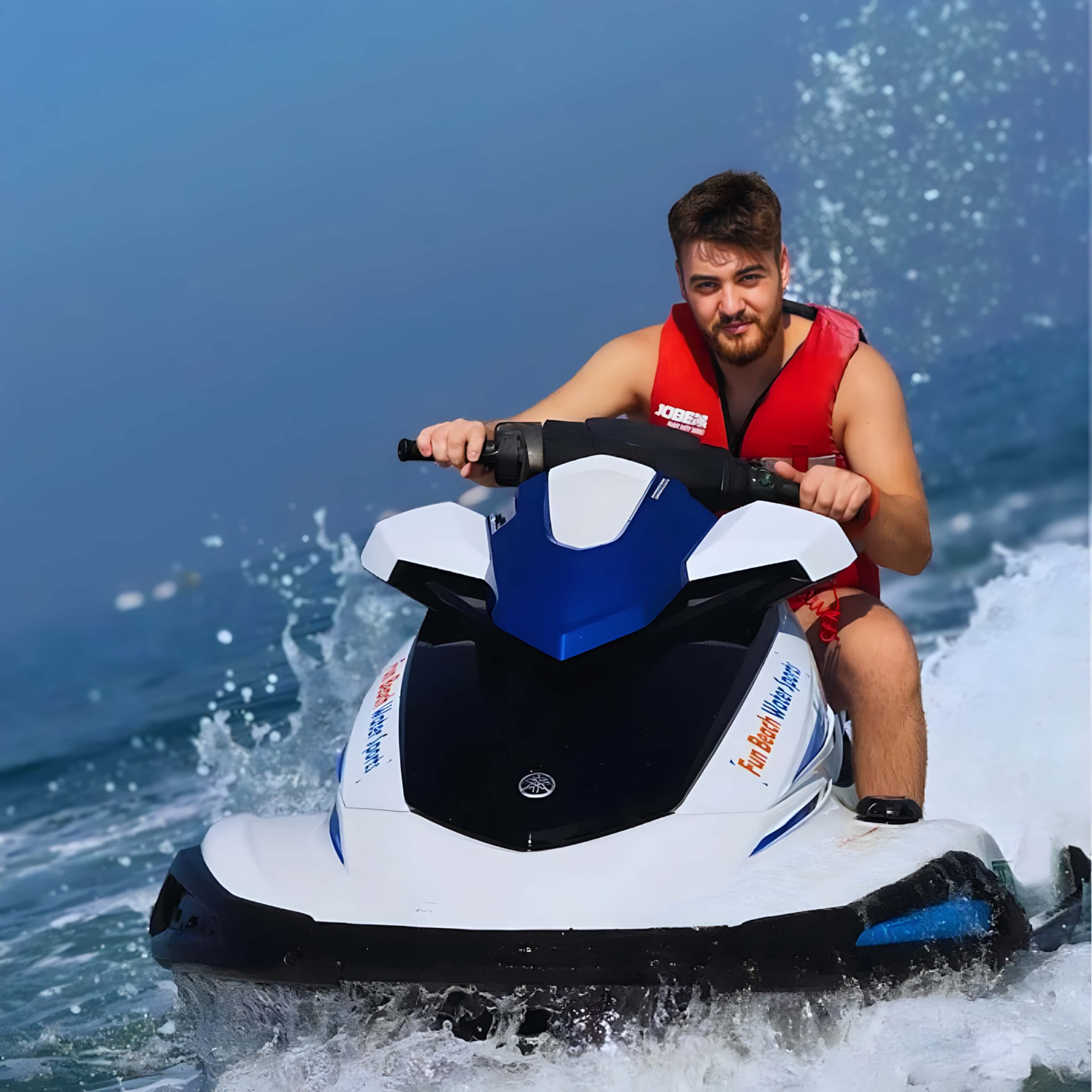 Rider on a jet ski cruising across the Arabian Gulf in Dubai