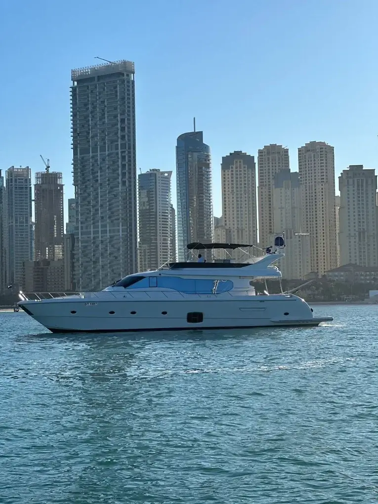 Yacht anchored with the full Dubai skyline in the background