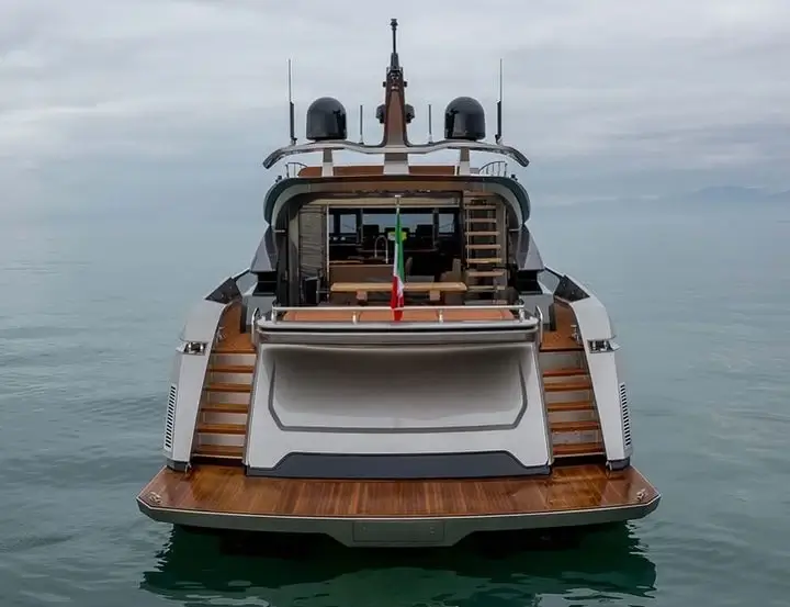 View of a luxury yacht stern and swim platform on calm Dubai water